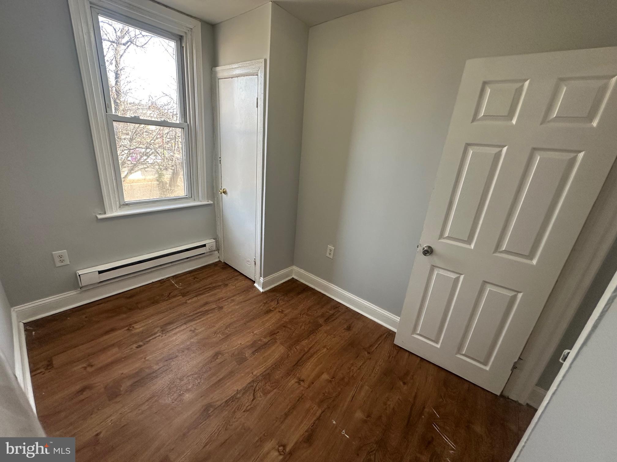 609 North Wilton Street Philadelphia, PA 19131 - Photo 11 of 15 a view of an empty room with wooden floor and a window
