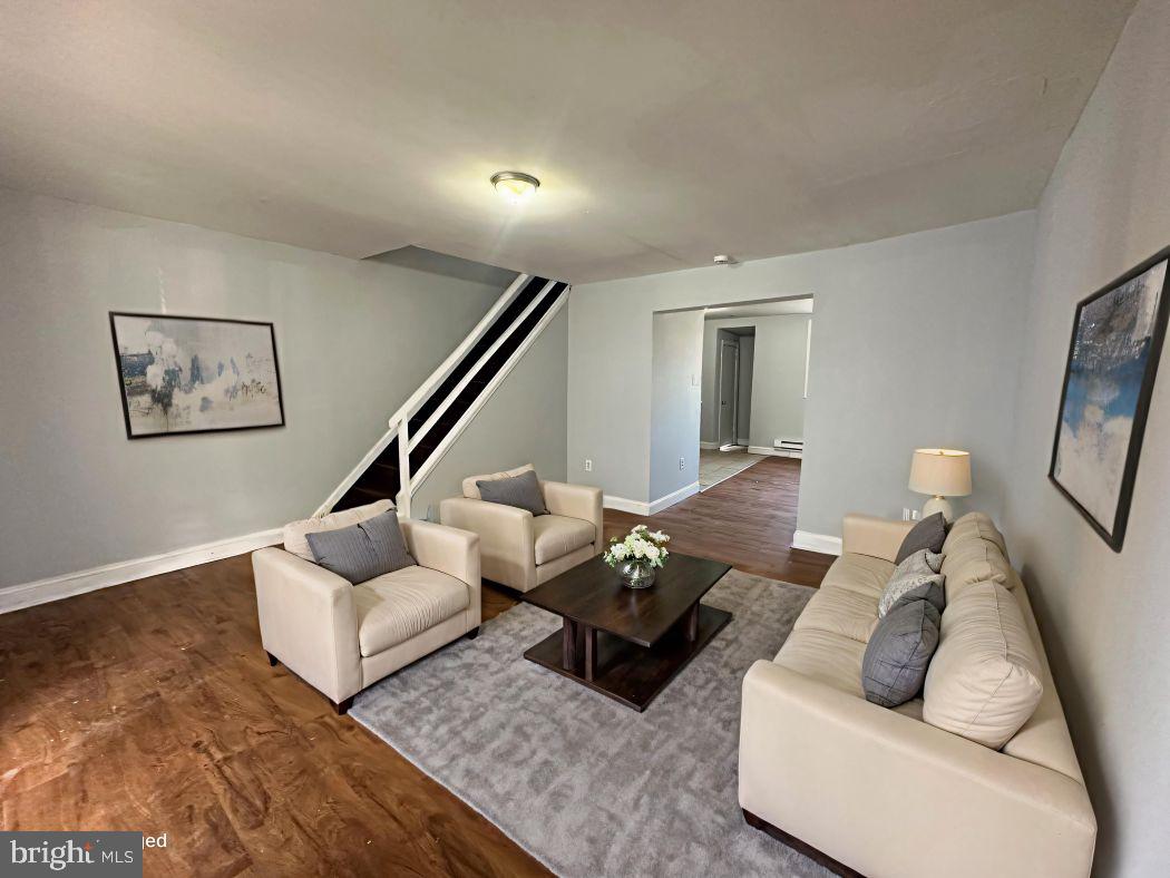 609 North Wilton Street Philadelphia, PA 19131 - Photo 2 of 15 a living room with furniture and wooden floor