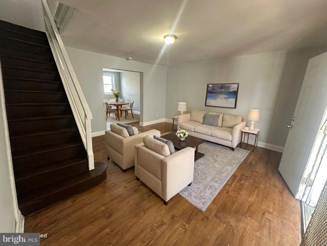 609 North Wilton Street Philadelphia, PA 19131 - Photo 3 of 15 a living room with furniture and a stairs