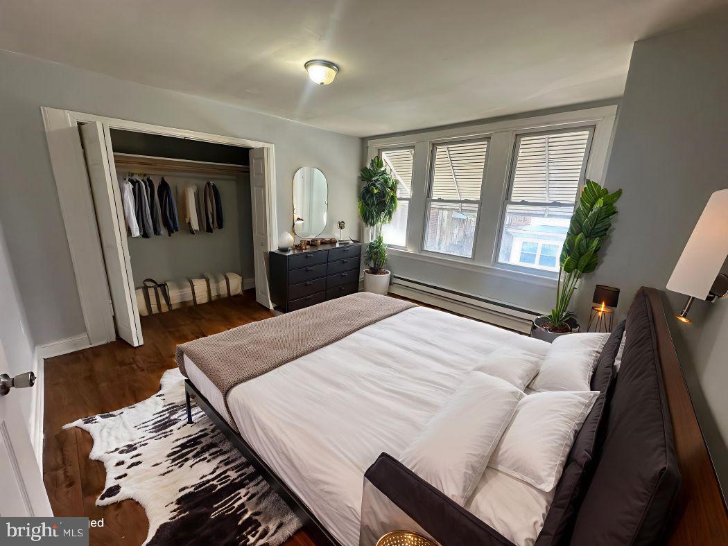 609 North Wilton Street Philadelphia, PA 19131 - Photo 4 of 15 a bedroom with a large bed and a window