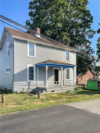 a front view of house with small garden