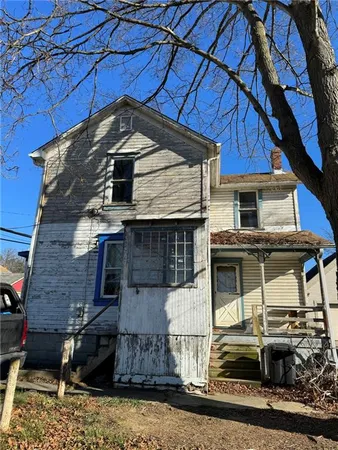a front view of a house with garage