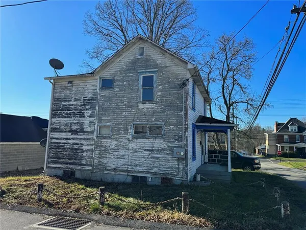 a brick building with a yard