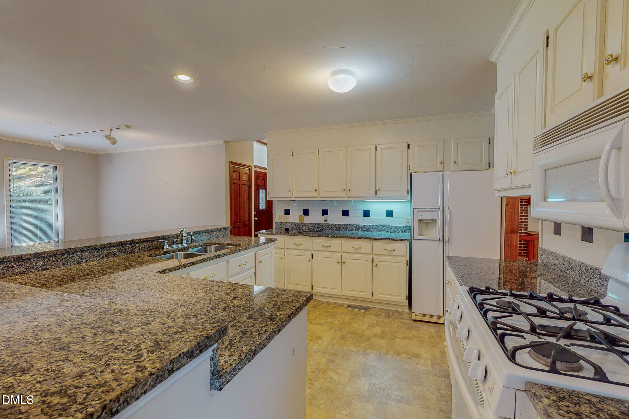 11 Denada Path Roxboro, NC 27574 - Photo 44 of 62 a kitchen with stainless steel appliances granite countertop a stove and a sink