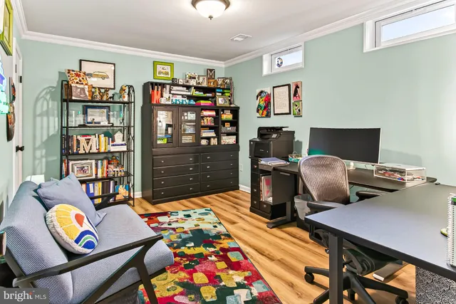 a bedroom with furniture and a book shelf