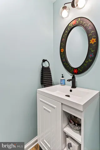 a bathroom with a sink and a mirror