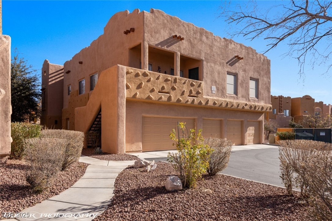 730 Hardy Way, Unit A Mesquite, NV 89027 - Photo 1 of 74 View of front facade with driveway, stairs, and a