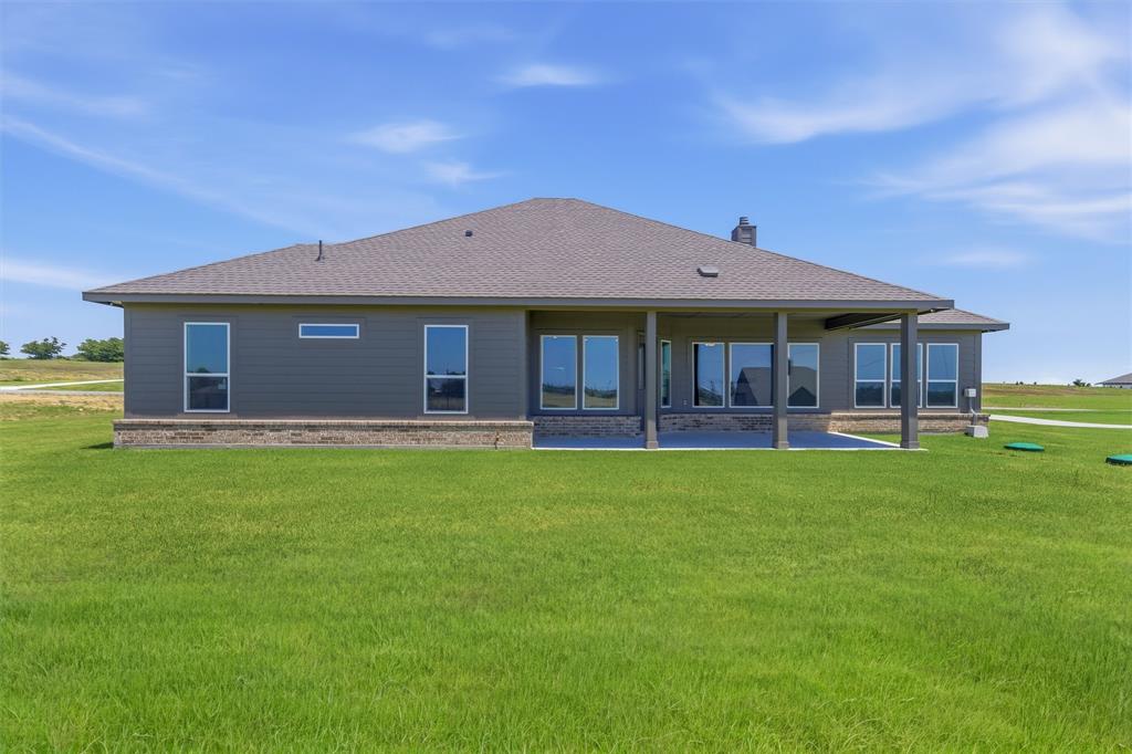 114 Hillview Trail Decatur, TX 76234 - Photo 25 of 27 Expansive green lawn bordering the rear exterior of the property