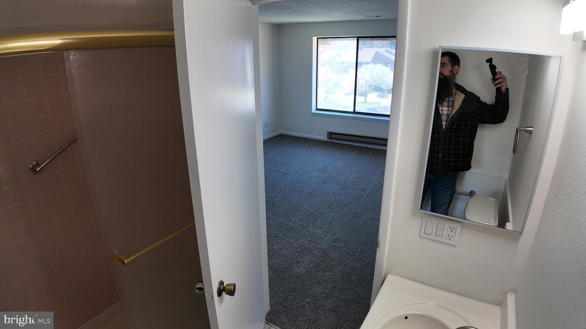 15311 Beaverbrook Court, Unit 903B Silver Spring, MD 20906 - Photo 32 of 36 a bathroom with a window