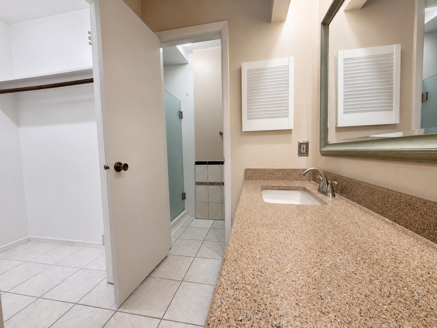 5810 Sunnygate Drive Spring, TX 77373 - Photo 7 of 16 a bathroom with a granite countertop sink a mirror and a bathtub