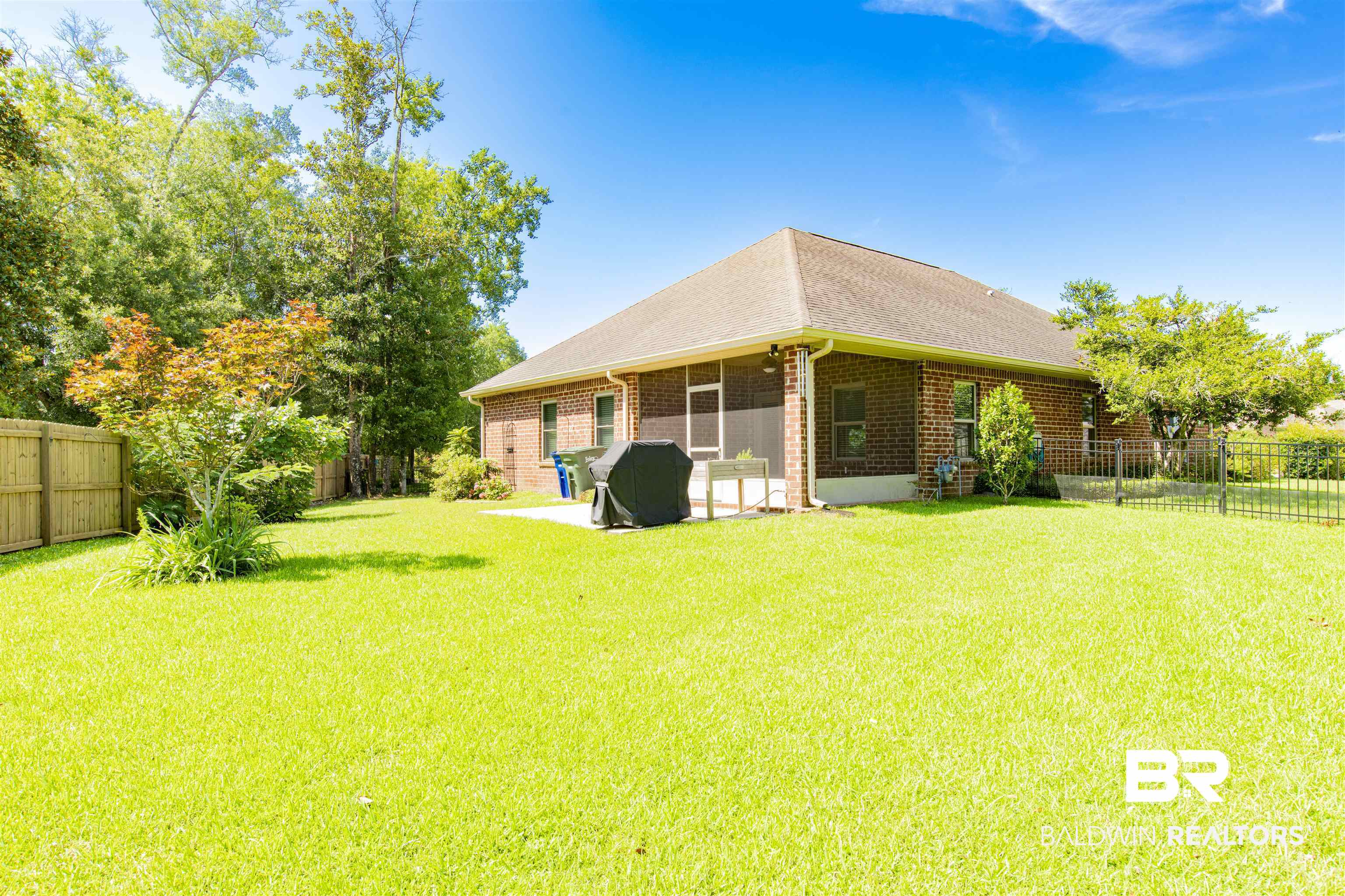 1476 Surrey Loop Foley, AL 36535 - Photo 31 of 31 Fenced backyard with a sunroom