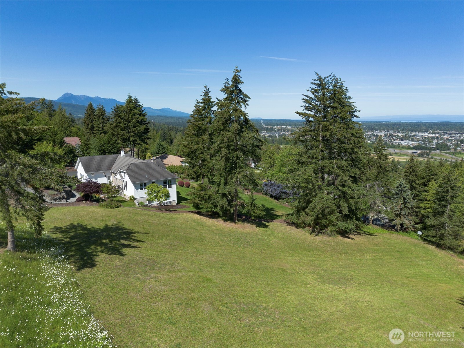 1 Owls Nest Road Sequim, WA 98382 - Photo 4 of 31 a view of a town with barn in the background