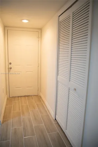 an empty room with a wooden door