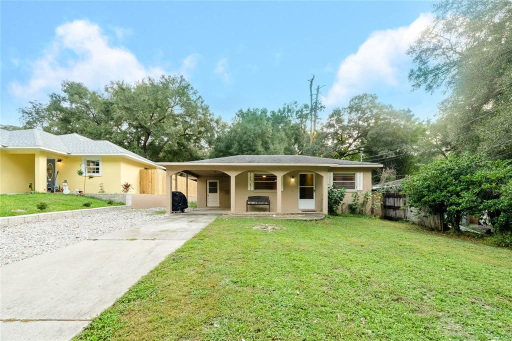 25200 Quaker Ridge Avenue Mount Plymouth, FL 32776 - Photo 1 of 1 a view of a house and a yard with trees