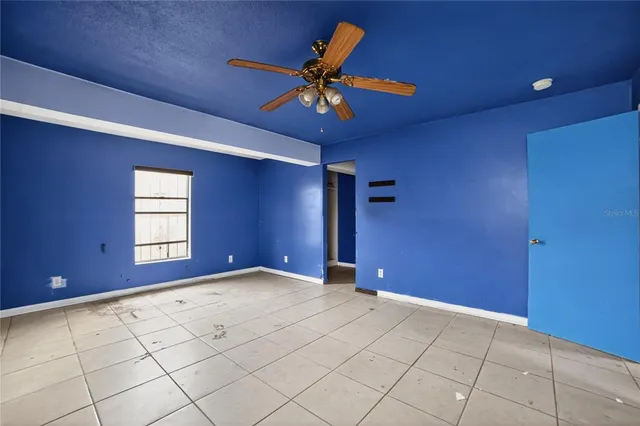 a view of an empty room with a window