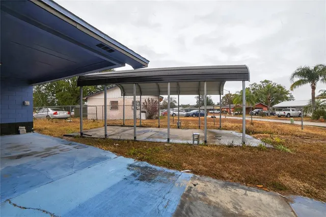 a view of a living room and floor to ceiling window