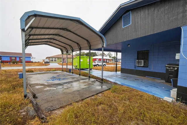 a view of a swimming pool with an outdoor seating