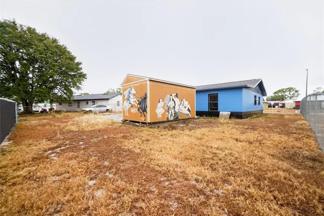 a view of a house with basketball court