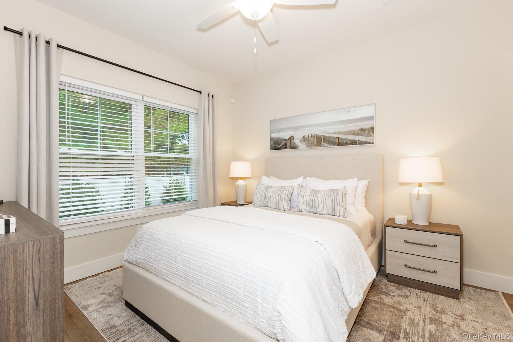 266 Farmingdale Road, Unit 111 West Babylon, NY 11704 - Photo 1 of 1 a bedroom with a bed and a window