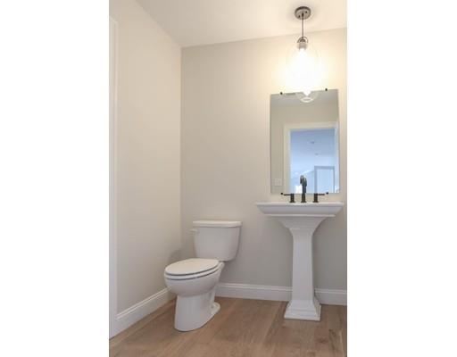 815 Main Street Acton, MA 01720 - Photo 13 of 27 a bathroom with a toilet a sink and mirror