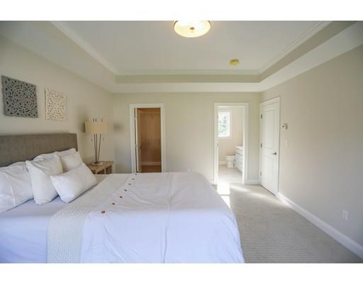 815 Main Street Acton, MA 01720 - Photo 15 of 27 a bedroom with a bed and a lamp