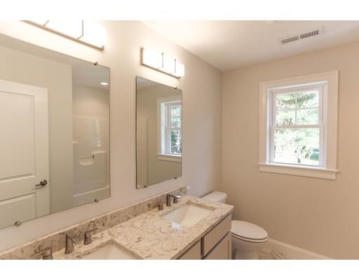815 Main Street Acton, MA 01720 - Photo 23 of 27 a bathroom with a sink and a mirror