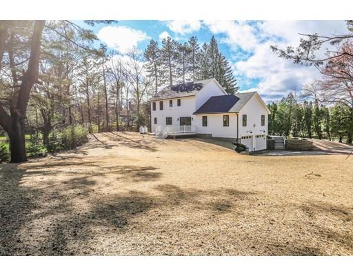 815 Main Street Acton, MA 01720 - Photo 26 of 27 a view of large house with a yard covered in snow