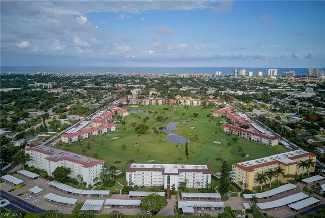 an aerial view of residential houses with outdoor space