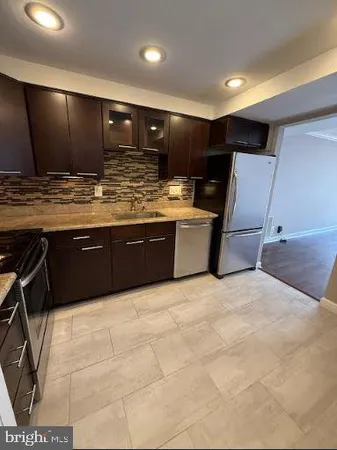 a large bathroom with a large tub and sink