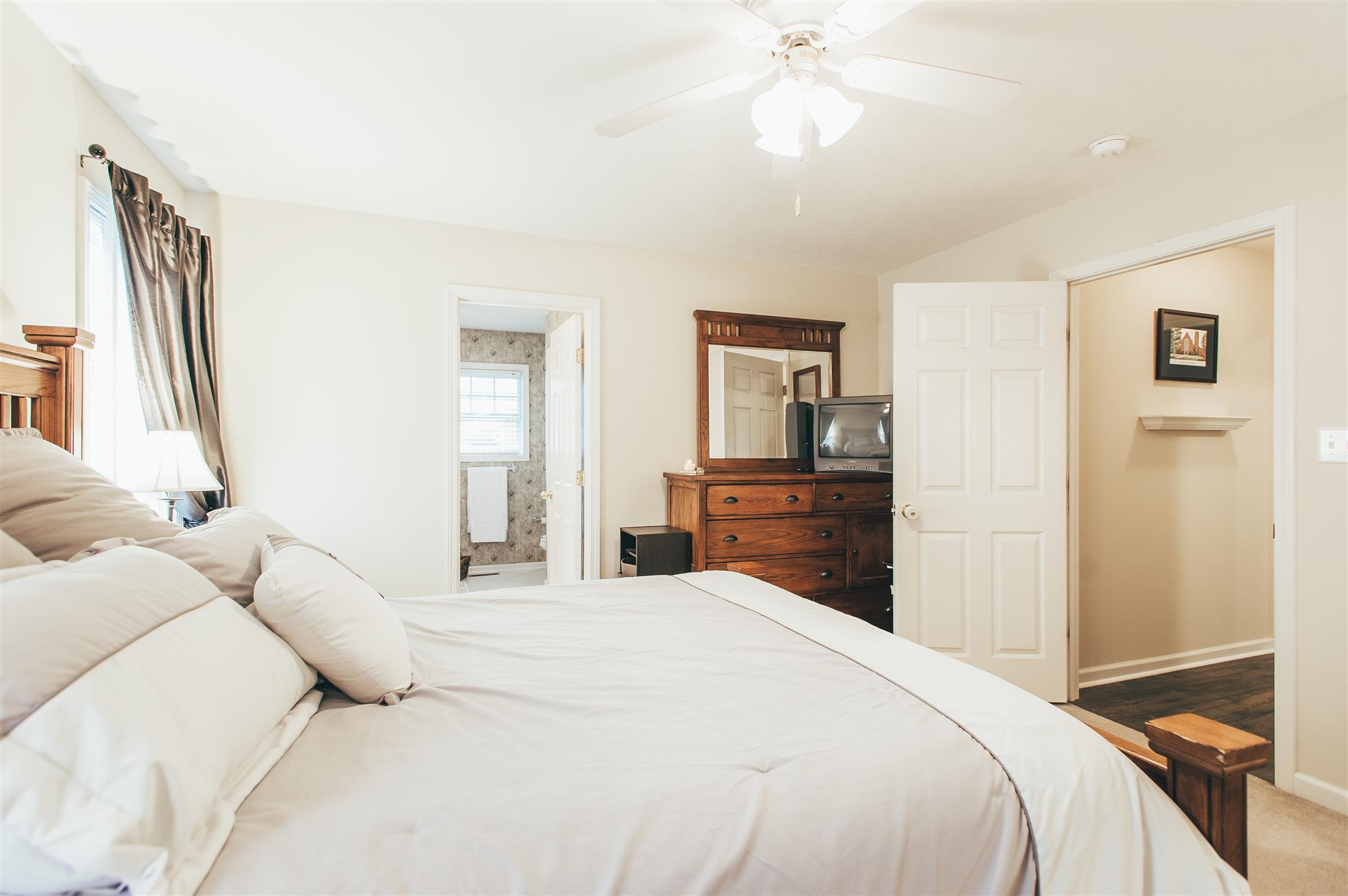 134 Abbey Road Gallatin, TN 37066 - Photo 12 of 18 a bedroom with a bed and a chandelier
