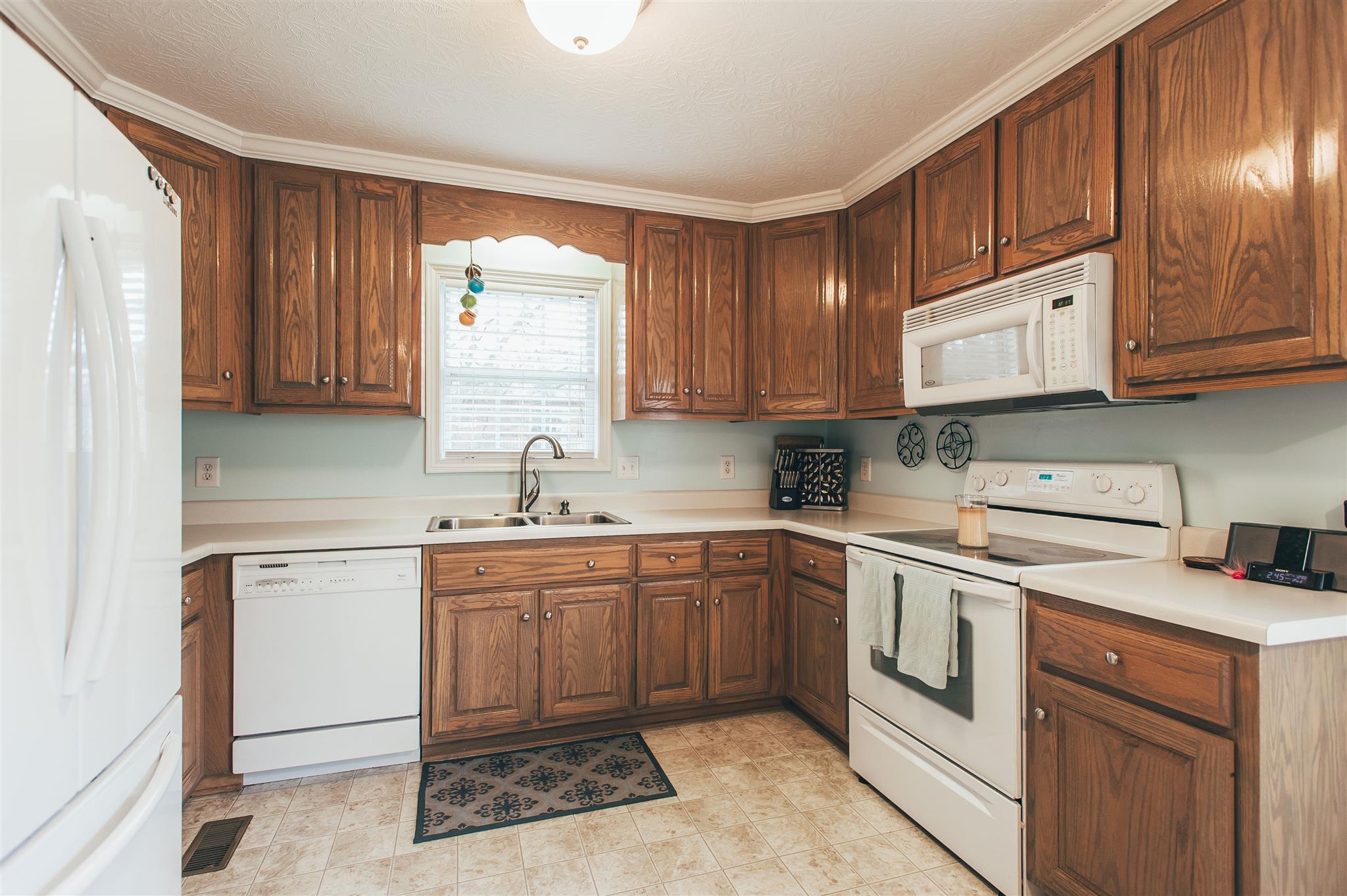 134 Abbey Road Gallatin, TN 37066 - Photo 7 of 18 a kitchen with a sink stove and cabinets