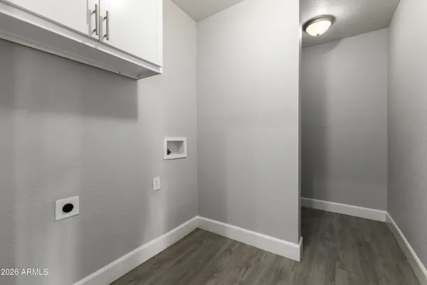 a view of a small space with wooden floor