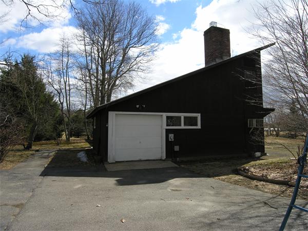49 Powisset Street Dover, MA 02030 - Photo 7 of 7 a front view of a house with a yard