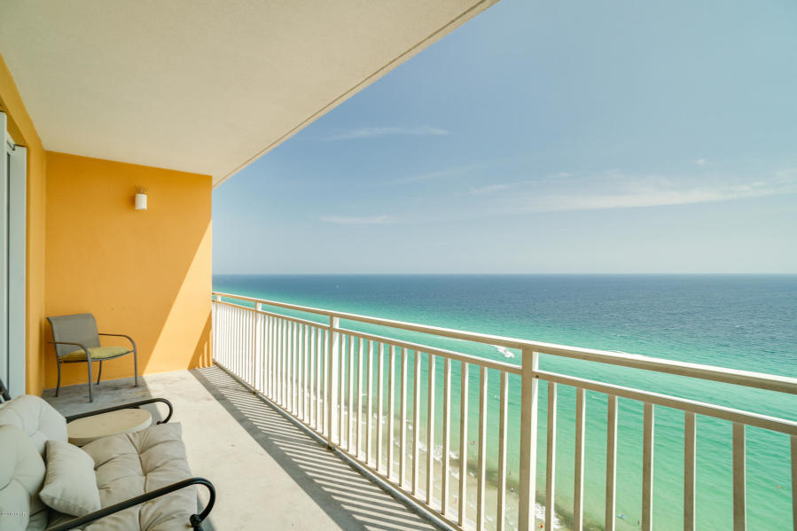 17739 Front Beach Road, Unit 1902W Panama City Beach, FL 32413 - Photo 18 of 30 a view of a balcony with furniture and a floor to ceiling window
