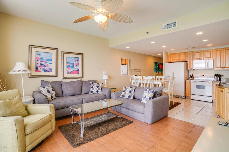 17739 Front Beach Road, Unit 1902W Panama City Beach, FL 32413 - Photo 5 of 30 a living room with furniture and kitchen view