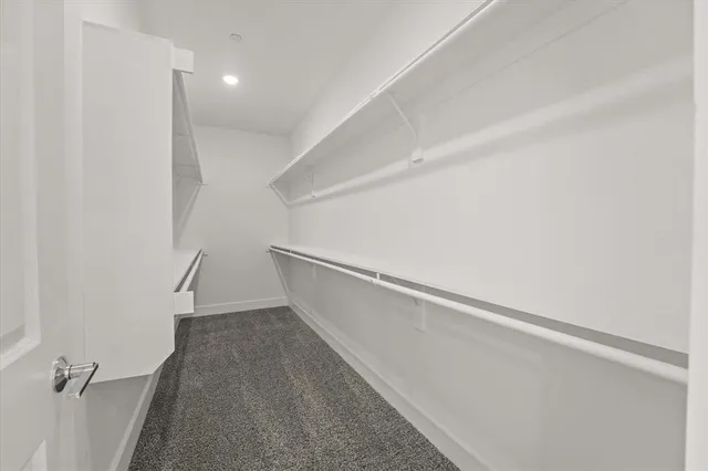 a bathroom with a granite countertop sink shower and a mirror