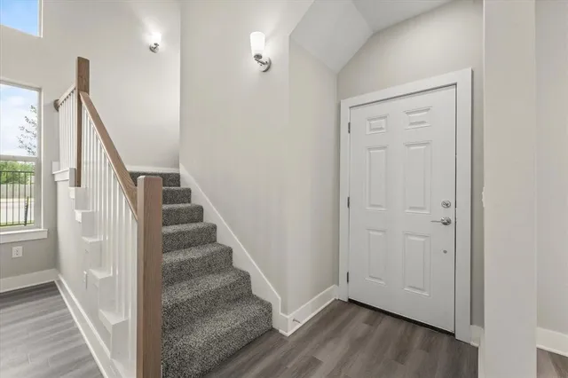 a view of entryway with wooden floor