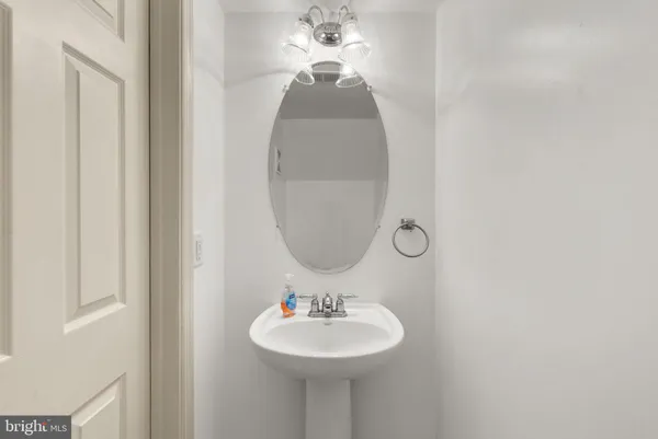 a bedroom with bed couch and window