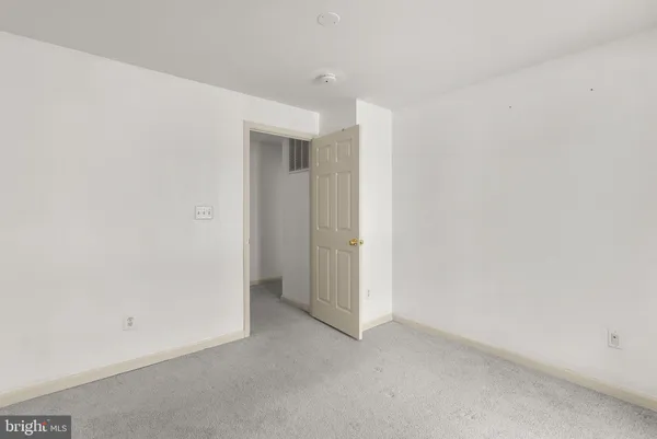 a bathroom with a bathtub shower sink vanity mirror and toilet