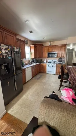 a room with a bed furniture and a flat screen tv