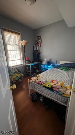 a bedroom with a bed and a table
