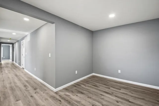 a view of room with wooden floor