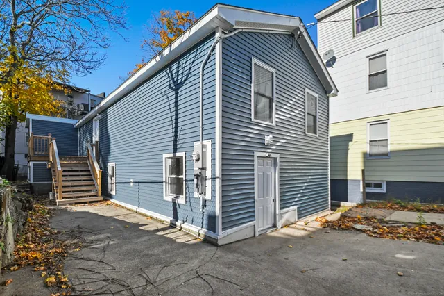 a view of a house with wooden fence