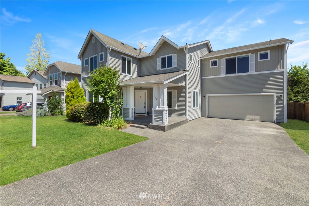 3129 Walker Road DuPont, WA 98327 - Photo 2 of 33 a front view of a house with a yard