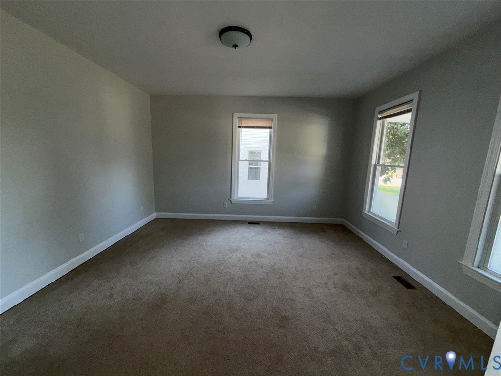 113 West Main Street Wakefield, VA 23888 - Photo 6 of 19 an empty room with a window