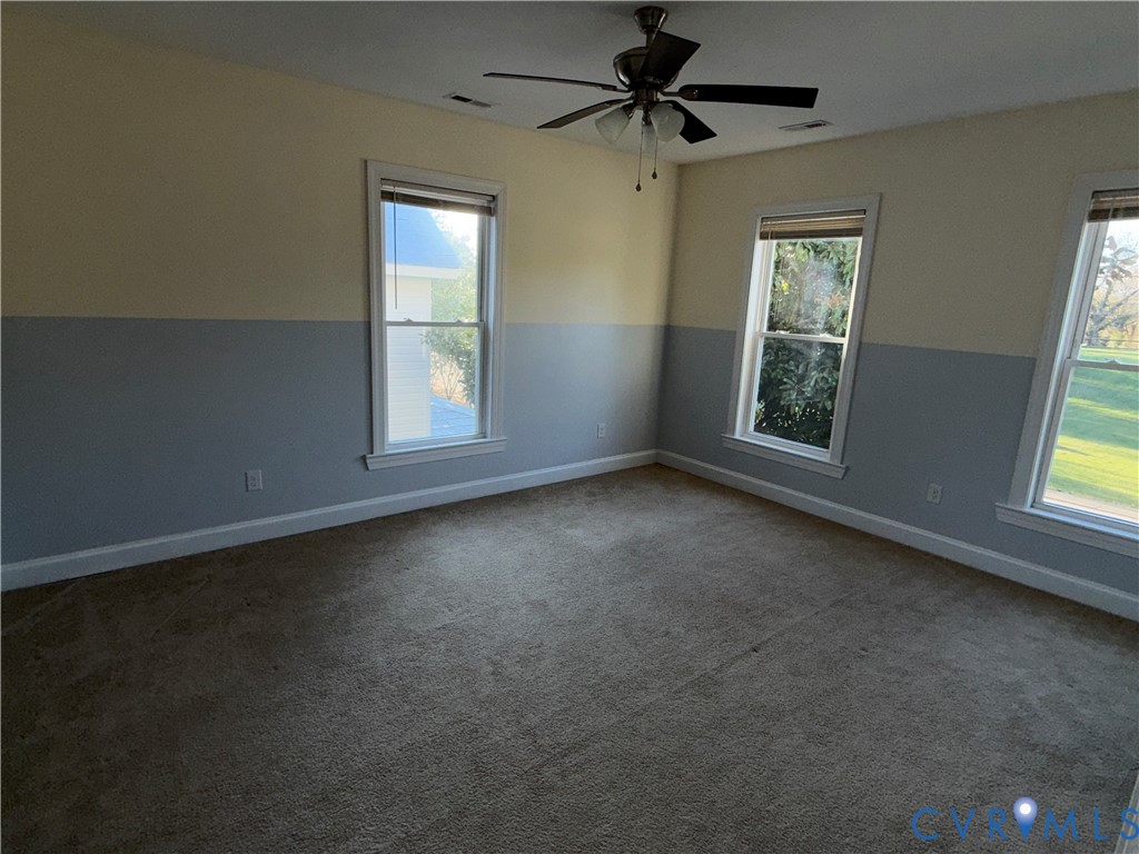 113 West Main Street Wakefield, VA 23888 - Photo 10 of 19 an empty room with a window