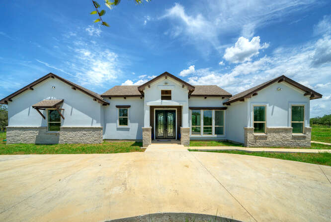 0 Patterson Road Flatonia, TX 78941 - Photo 1 of 1 a front view of a house with a yard and garage