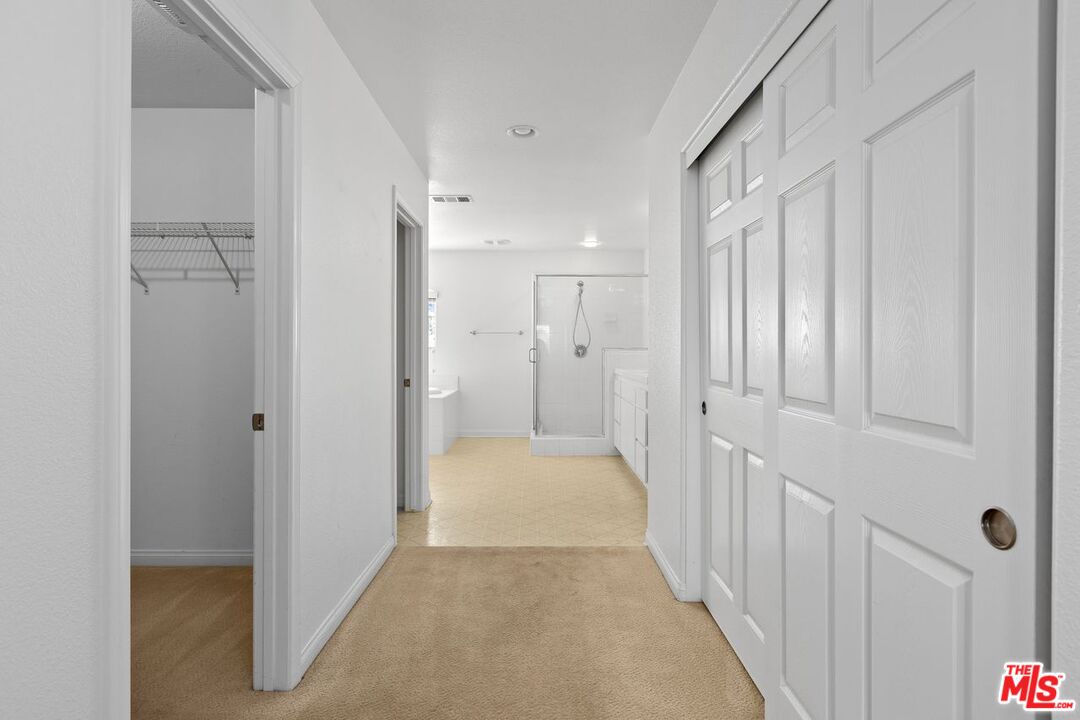 1061 Boulder Place Oceanside, CA 92057 - Photo 13 of 19 a view of a hallway with wooden floor and closet