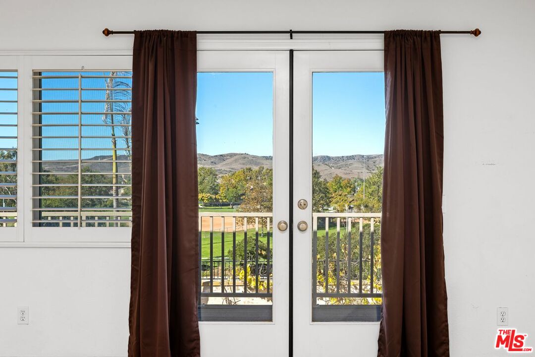 1061 Boulder Place Oceanside, CA 92057 - Photo 16 of 19 a view of a glass door and a window