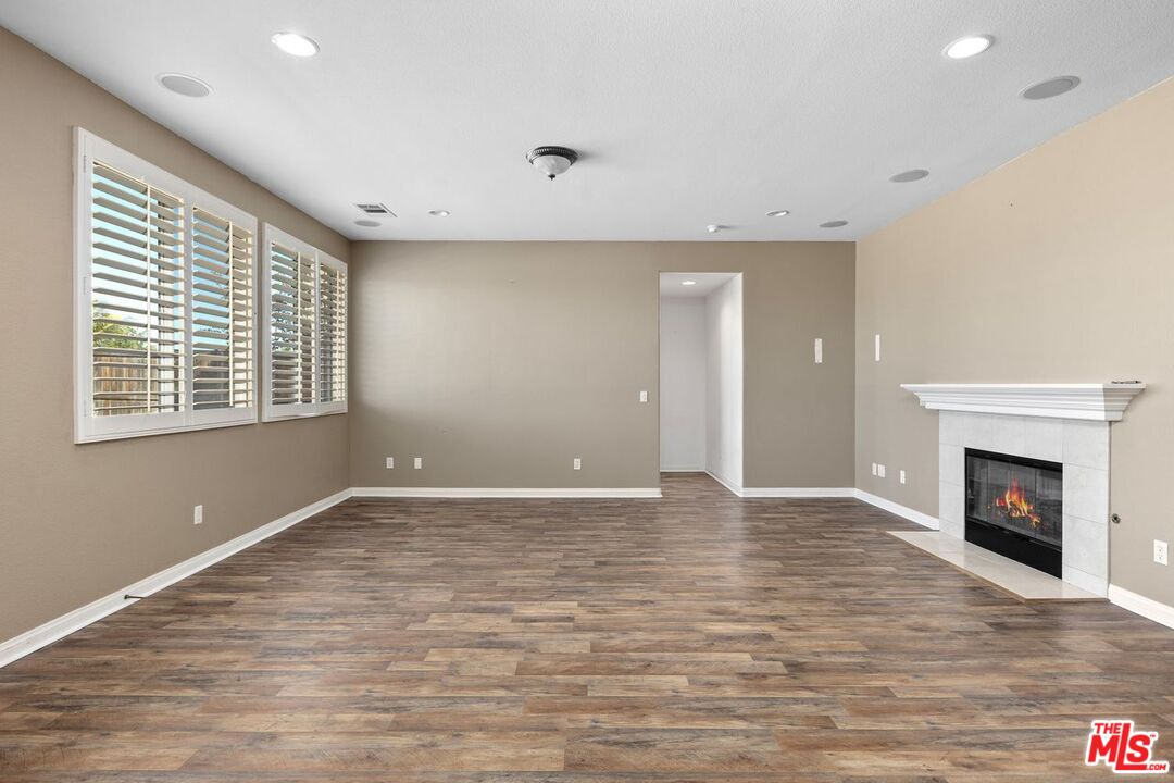 1061 Boulder Place Oceanside, CA 92057 - Photo 8 of 19 a view of an empty room with a window and fireplace